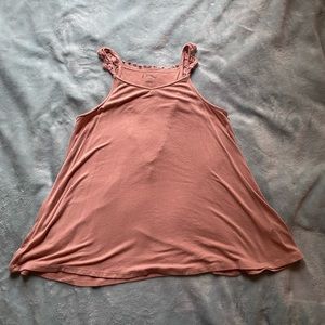 pink flowy tank top with butterfly back and sleeve design.